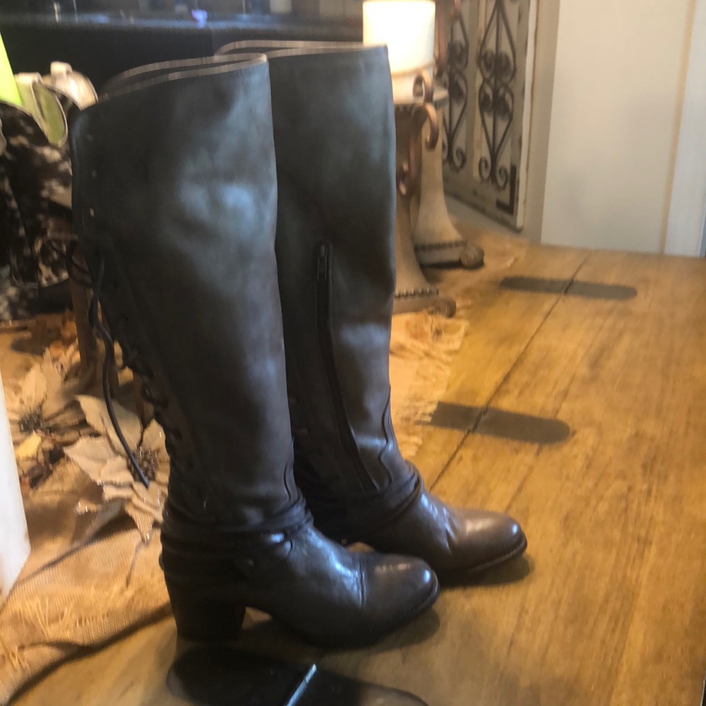 Beautiful tan/brownish gray leather w laced up back Freebird Boots.